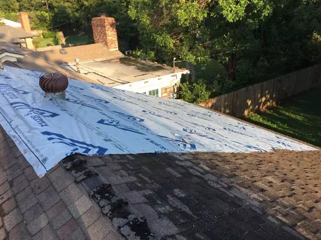 Top View Of Roof Being Repaired From Storm Damage